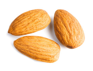Three almonds nuts isolated on white background with clipping path. Top view.