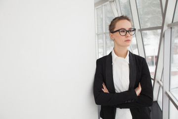 Portrait of young business woman in the office.