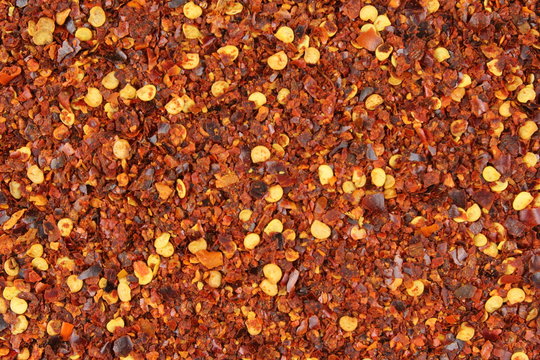 crushed red pepper flakes closeup food background texture
