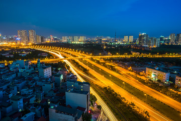 Hanoi cityscape at Thang Long multiple land highway at night.