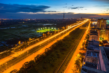 Hanoi cityscape at Thang Long multiple land highway at night.