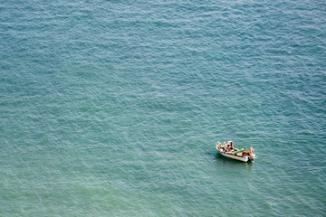 Fishermen working on a boat on the mediterranean sea