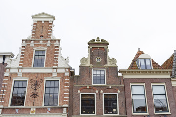 Fototapeta na wymiar Typically dutch facades of old buildings in Alkmaar,The Netherlands