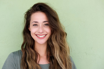 young happy woman on green background