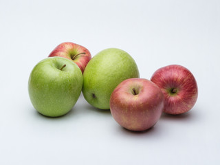 red and green apples on white background