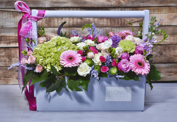 Beautiful flowers in a turquoise wooden box