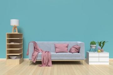 The interior has a gray sofa and lamp on empty blue wall background,3D rendering