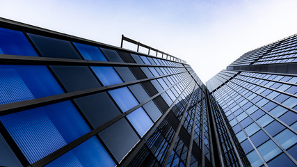 Fototapeta na wymiar Blue skyscraper facade. office buildings. modern glass silhouettes of skyscrapers