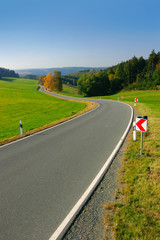 Winding Road through Rural Autumn Landscape