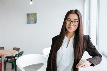 Young Asian business woman near the window