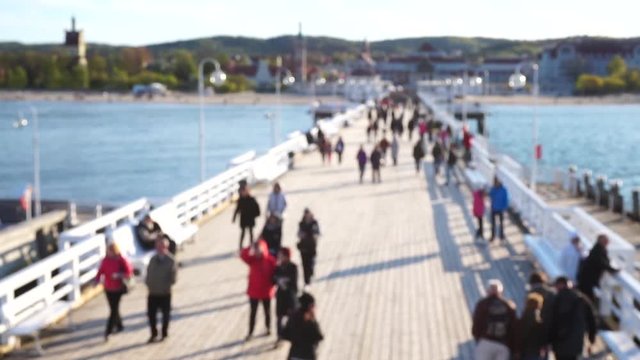 Poland people walk by the famous wooden pier in Sopot, Poland.