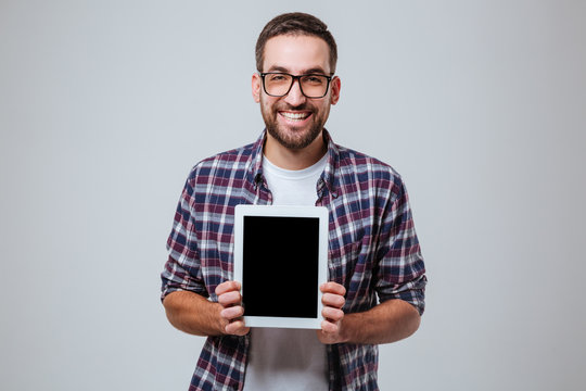 Bearded Man In Eyeglases Showing Blank Tablet Computer Screen