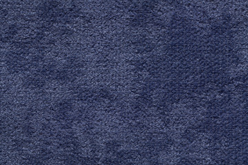 Navy blue fluffy background of soft, fleecy cloth. Texture of textile closeup
