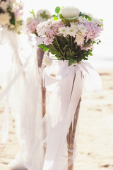 Vintage roses bouquet arrange for wedding decoration with sea background