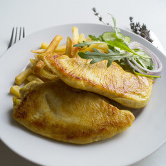 Turkey steak on a wooden Board. on white background
