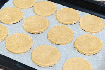 Raw oatmeal cookies on baking sheet
