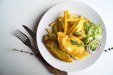 Turkey steak on a wooden Board. on white background