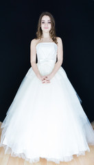 Fototapeta premium bride on black background. dress