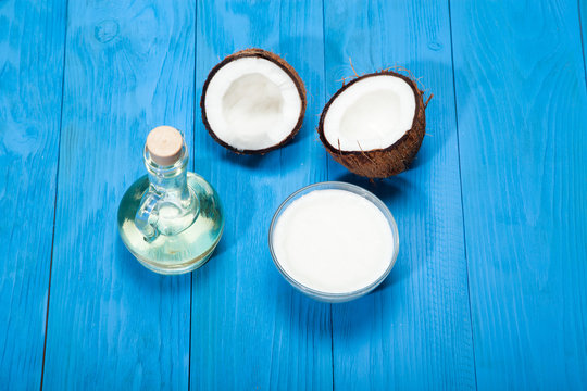 Coconut oil on a blue wooden background