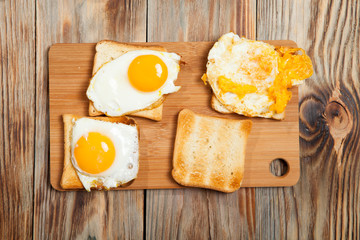 toast and egg on wooden table