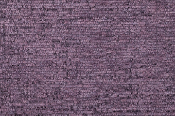 Violet fluffy background of soft, fleecy cloth. Texture of textile closeup
