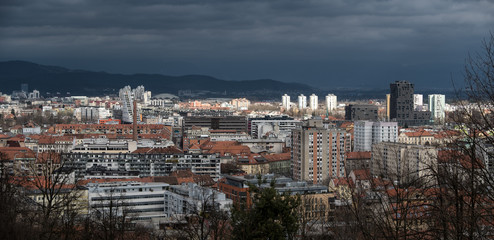Panoramic view over the city of Ljubljana from the city castle with dramatic clouds in the background