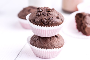 Chocolate muffins with chocolate drops Copy space Wooden background
