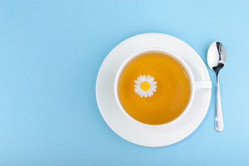 Cup of tea and chamomiles