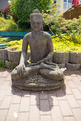 Fototapeta na wymiar Female Budha statue portrait. Concept: Meditation, Religion, Ancient.
