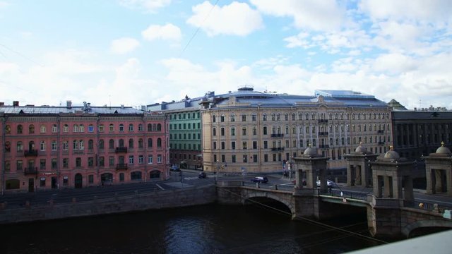 Center of the city timelapse with view on river, bridge and historical buildings