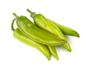 Green fresh jalapeno peppers close up on white