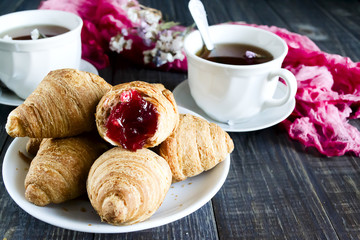 Fresh croissants with fruit tea