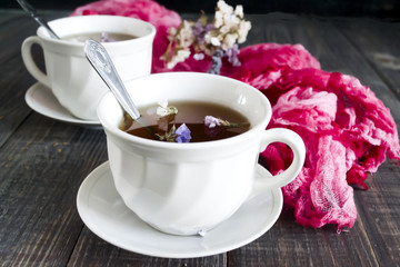Herbal tea on a dark wooden background