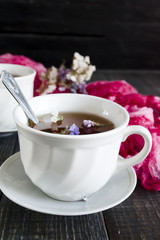 Herbal tea on a dark wooden background