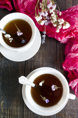 Herbal tea on a dark wooden background