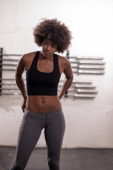 Fototapeta na wymiar black woman after a workout at the gym