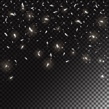 Silver holiday confetti on dark transparent background