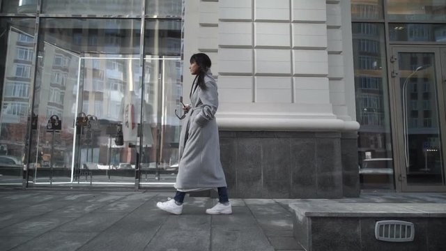 Female walking down city street