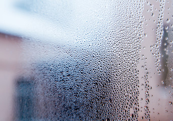 Winter. Raining. Water bubbles on a window