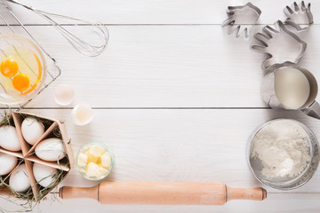 Baking ingredients on white rustic wood background, copy space