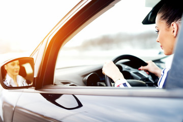 Drive car copy space woman careful watching on the road.