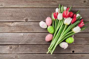 Easter eggs and colorful tulips