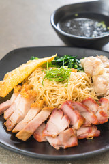 Egg noodle with red roast pork, crispy pork, dumplings and soup