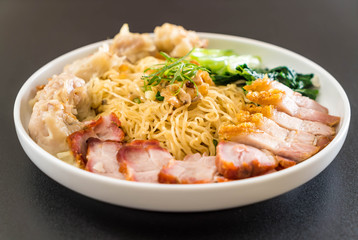 Egg noodle with red roast pork, crispy pork, dumplings and soup