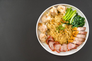 Egg noodle with red roast pork, crispy pork, dumplings and soup