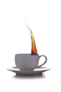 splash of coffee in a cup on a white background