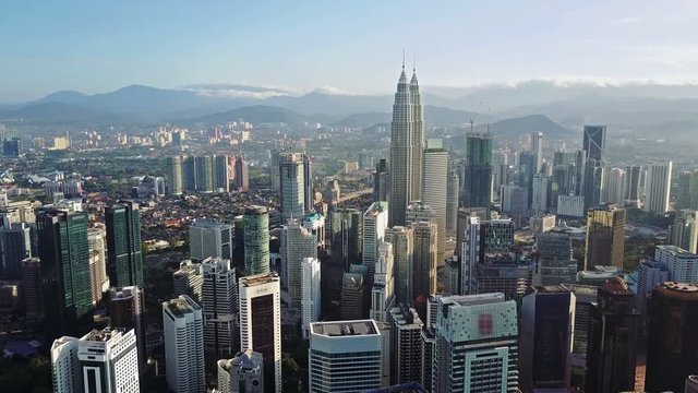 Aerial view of kuala lumpur cityscape. Drone video of asian scyscrapers. Blurred all logotypes.