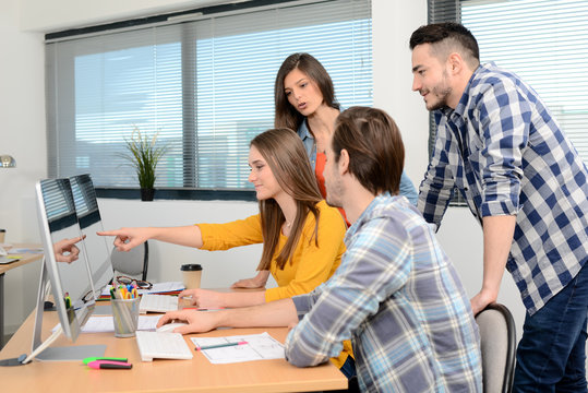 group of young cool hipster creative business people in casual wear working together in meeting room of a startup company