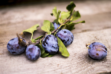 blue plum lies on a board