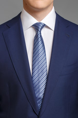 man in blue tuxedo with light blue tie - 138853750